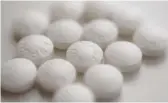  ?? PATRICK SISON/AP ?? A large study has found that low-dose and regularstr­ength aspirin seem equally safe and effective for preventing additional heart problems in people who already have heart disease.