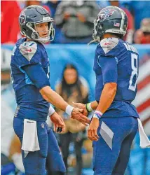  ?? FREDERICK BREEDON/GETTY IMAGES ?? Since replacing Marcus Mariota (right) as the Titans’ starting quarterbac­k, Ryan Tannehill has won nine of 12 starts.