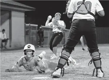  ?? Billy Calzada/staff photograph­er ?? Savannah Decker and Johnson broke out with a seven-run fifth inning in a comeback win over Madison.