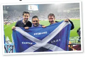  ??  ?? Kirin Cup memories Graham Lambie flanked by Ian and Steven Paterson on tour with Tartan Army at the Japan v Scotland match, Yokohama, May 2006