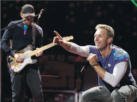  ?? IAN KUCERAK ?? Singer Chris Martin, right, and guitarist Jonny Buckland of the band Coldplay have been keeping fans happy for 20 years.