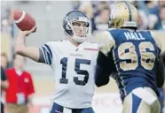  ?? JOHN WOODS/THE Canadian Press ?? Toronto Argonauts’ quarterbac­k Ricky throws a pass against the Winnipeg Blue Bombers in CFL action Friday. Ray threw for 196 yards before leaving the game with a knee injury.