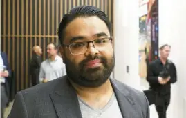  ?? TERRENCE ANTONIO JAMES/CHICAGO TRIBUNE PHOTOS ?? Danny Torres attends an installati­on of his work in a new office building at 448 N. LaSalle St. in Chicago on June 8.