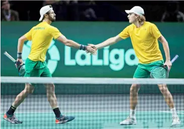  ?? THOMAS COEX/AGENCE FRANCE-PRESSE ?? JORDAN Thompson (left) and Max Purcell join hands in leading Australia to its first Davis Cup final in almost two decades.