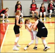  ??  ?? Pea Ridge’s Hayley West and Farmington’s Carson Dillard battle for possession of the basketball.