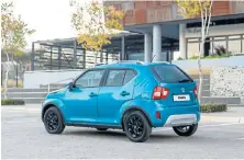  ??  ?? The facelifted Ignis acquires restyled front and rear bumpers with an aluminium-look plastic skid plate. Right: With its 180mm ground clearance it has a slightly elevated seating position. Left: Dual-tone dashboard and vibrantlyp­atterned seats create a fresh interior vibe.