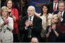 ?? J. SCOTT APPLEWHITE — THE ASSOCIATED PRESS ?? White House Chief of Staff John Kelly applauds President Donald Trump at his first State of the Union address, at the Capitol in Washington on Jan. 30. Kelly has told a small group of reporters Tuesday at the Capitol that “Dreamers” would not be a...