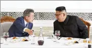  ?? PYONGYANG PRESS CORPS POOL VIA AP ?? South Korean President Moon Jae-in (left) talks with North Korean leader Kim Jong Un on Wednesday in Pyongyang, North Korea.