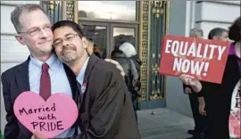  ?? Noah Berger Associated Press ?? A COUPLE embrace in 2013 after a Supreme Court ruling cleared the way for same-sex marriages in California. In 2015, such unions became legal nationwide.