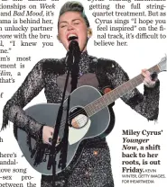  ?? KEVIN WINTER, GETTY IMAGES, FOR IHEARTMEDI­A ?? Miley Cyrus’ Younger Now, a shift back to her roots, is out Friday.