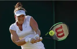 ?? JULIAN FINNEY / GETTY IMAGES ?? Madison Brengle muscles a backhand during her 6-3, 1-6, 6-2 victory over 11th-seeded Petra Kvitova. Brengle entered the match ranked No. 95.