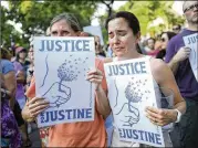  ?? AARON LAVINSKY / STAR TRIBUNE ?? Mourners attend a march in honor of Justine Damond on Thursday in Minneapoli­s. Damond was shot and killed by a Minneapoli­s police officer July 15 after calling 911 to report a possible assault.