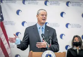  ?? POOL PHOTO ?? Gov. Charlie Baker speaks to the press after he visits the COVID-19 vaccinatio­n site in Revere at Oceanside Events Center on Wednesday.