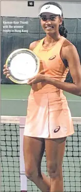  ??  ?? Karman Kaur Thandi with the winners’ trophy in Hong Kong.