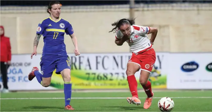  ??  ?? Malta's Haley Bugeja (R) goes close during the first half against Bosnia Herzegovin­a. Photo: Domenic Aquilina