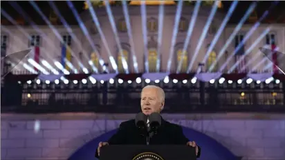  ?? EVAN VUCCI — THE ASSOCIATED PRESS ?? President Joe Biden delivers a speech marking the one-year anniversar­y of the Russian invasion of Ukraine on Tuesday during a visit to the Royal Castle Gardens in Warsaw.