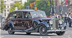  ?? ?? The King and Queen in a Rolls-royce Phantom IV built for the late Queen Elizabeth