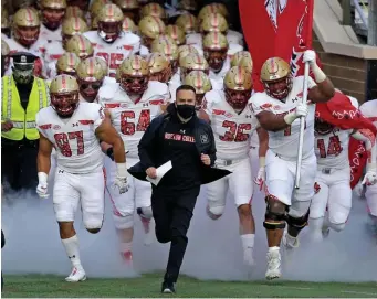  ?? STuART cAHILL / HeRALd sTAFF FILe ?? PITCH MAN: Boston College head coach Jeff Hafley leads his team onto the field to play Notre Dame at Alumni Stadium on Nov. 14.