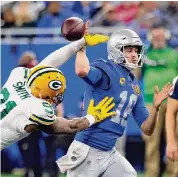  ?? Duane Burleson/Associated Press ?? The Packers’ Preston Smith forces Lions QB Jared Goff to fumble Thursday. Goff had three fumbles.