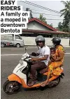  ?? ?? EASY RIDERS
A family on a moped in downtown Bentota