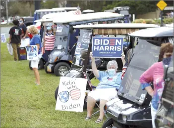  ??  ?? Supporters of Joe Biden rally during Trump’s campaign stop at The Villages Polo Club.