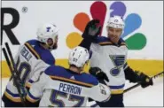  ?? JOSIE LEPE — THE ASSOCIATED PRESS ?? St. Louis Blues’ Ryan O’Reilly (90), David Perron (57), celebrate with Jaden Schwartz (17), who scored a goal against the San Jose Sharks in the third period in Game 5 of the NHL hockey Stanley Cup Western Conference finals in San Jose on Sunday.