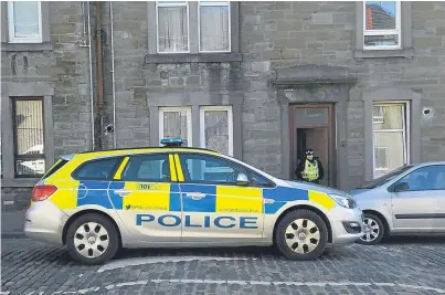  ??  ?? There was much police activity on Morgan Street, Dundee, yesterday following the attack.