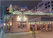  ?? CHELSEY LEWIS/MILWAUKEE JOURNAL SENTINEL ?? Cafe Benelux in Milwaukee's ThirdWard added six Lux Domes to itsrooftop for the winter. The domes have small heatersand fit eight people each andare open to reservatio­ns only. They are sold out through Dec. 23.