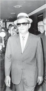  ?? CHICAGO TRIBUNE ?? Sam “Momo” Giancana leaves the courtroom in the Federal Building after appearing before a judge before being jailed on June 1, 1965.