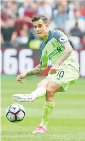  ?? — AFP photo ?? Liverpool's Brazilian midfielder Philippe Coutinho plays the ball during the English Premier League football match between West Ham United and Liverpool atThe London Stadium,in east London on May 14, 2017.