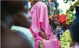  ?? Photograph: Ami Vitale/Alamy ?? A young Fulani bride sits veiled during a wedding ceremony in Dembel Jumpora, GuineaBiss­au.