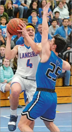  ?? DANA JENSEN/THE DAY ?? Waterford’s Ryan Bakken, left, goes up for a shot against Old Lyme’s Ray Doll during Thursday night’s boys’ basketball game at Waterford High School. Waterford won the game 91-85 in double overtime. Visit www.theday.com to see a photo gallery from the game.