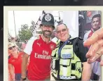  ??  ?? 2 BOBBIES Robert Pires and a policeman at Arsenal’s King’s Cross kit launch yesterday