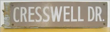  ?? Photo Courtesy of Xyta Lucas ?? Original street signs, such as this one for Cresswell Drive, in Cooper's Bella Vista Village were made of wood. The name was taken from a British atlas that listed Cresswell as the name for several English locales.