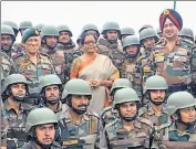  ?? ANI ?? Defence minister Nirmala Sitharaman (centre) with troops of the 28th Infantry Division at a forward post in J&amp;K on Sunday.