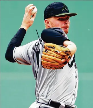  ?? ADAM GLANZMAN / GETTY IMAGES ?? Atlanta pitcher Sean Newcomb, a native of Middleboro, Massachuse­tts, gave up six hits, four walks and three runs to the Red Sox in the Braves’ 8-6 loss at Boston on Saturday.