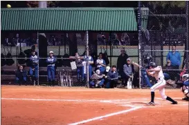  ?? Photos by TIM GODBEE / For the Calhoun Times ?? ( Calhoun’s Adella Carver connects for one of her two homers on Thursday night vs. Bremen. ( Calhoun’s Maggie McBrayer (4) delivers a pitch to the plate against Rutland on Thursday afternoon.