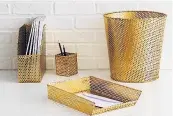  ??  ?? Macula gold mesh file tray, £15; waste bin, £20; magazine file, £18; pen pot, £15, all Habitat