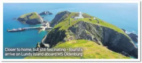  ??  ?? Closer to home, but still fascinatin­g – tourists arrive on Lundy Island aboard MS Oldenburg