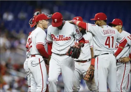  ?? BRYNN ANDERSON — THE ASSOCIATED PRESS ?? Philadelph­ia Phillies starting pitcher Enyel De Los Santos walks off after being taken out of a baseball game during the fifth inning against the Miami Marlins, Sunday in Miami.