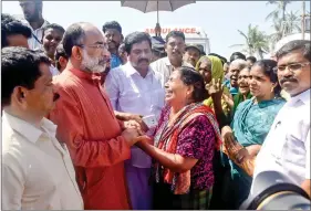  ?? IANS ?? Union Tourism Minister Alphons Kannanthan­am consoles those affected by Cyclone Ockhi during his visit to the coastal areas of Thiruvanan­thapuram, in Kerala, last Sunday.