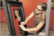  ?? Dave Rossman ?? Eva Goetz, painting conservato­r for the Kunsthisto­risches Museum in Vienna, uncovers “Jane Seymour” by Hans Holbein the Younger.