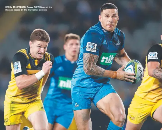  ?? READY TO OFFLOAD: Sonny Bill Williams of the Blues is chased by the Hurricanes defence. ??