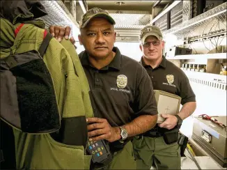  ?? JAY JANNER / AMERICAN-STATESMAN ?? Cpl. Jesse Carrillo (left) and officer George Ewing are members of the bomb squad. “Just as things would slow down, there would be another explosion,” Carrillo said.