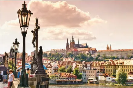  ?? DOMINIC ARIZONA BONUCCELLI ?? For more than a thousand years, Czech leaders have ruled from Prague Castle, regally perched on a hill above the Vltava River.