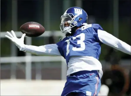  ?? ADAM HUNGER — THE ASSOCIATED PRESS ?? New York Giants wide receiver Odell Beckham attempts to make a catch during the team’s NFL football practice, Tuesday in East Rutherford, N.J.