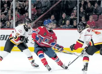  ?? SUPPLIED PHOTO ?? Marie-Philip Poulin, middle, of the Les Canadienne­s de Montreal is seen during a game against the Calgary Inferno on Dec. 10 in Montreal. The two teams will face off for the Clarkson Cup Saturday in Ottawa.