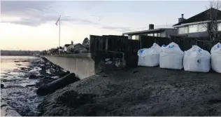  ??  ?? Residents of Delta have placed sandbags along the waterfront in anticipati­on of rising tides.