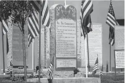  ?? Associated Press ?? n A Ten Commandmen­ts monument is seen Aug. 28, 2014, at the Bloomfield, N.M.,, Municipal Complex.