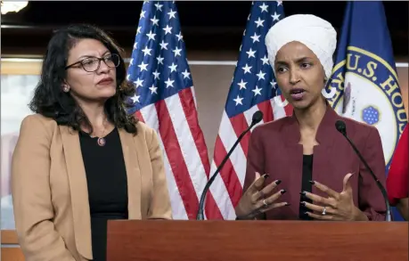  ?? J. SCOTT APPLEWHITE — THE ASSOCIATED PRESS FILE ?? U.S. Rep. Ilhan Omar, D-Minn, right, speaks, as U.S. Rep. Rashida Tlaib, D-Mich. listens, during a news conference at the Capitol in Washington. The U.S. envoy to Israel said he supports Israel’s decision to deny entry to two Muslim congresswo­men ahead of their planned visit to Jerusalem and the West Bank.